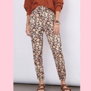 Anthropologie Diandra pleated front floral print tapered zipper hem pants Sz 4